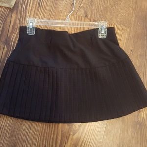 Pleated black red dotted mini skirt